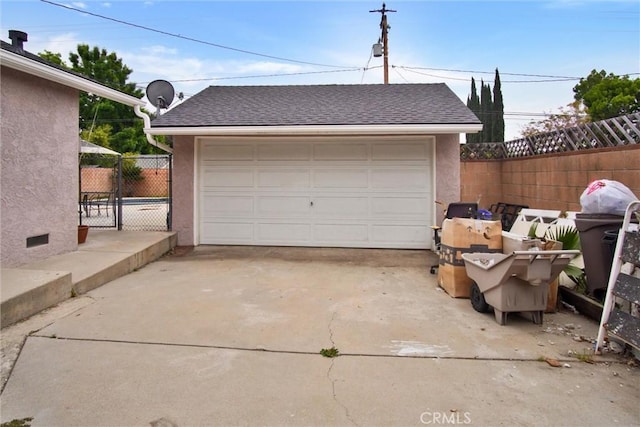 detached garage with fence
