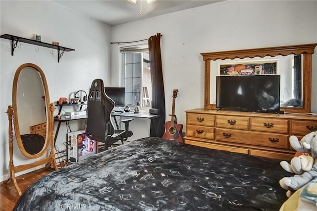 bedroom with wood finished floors
