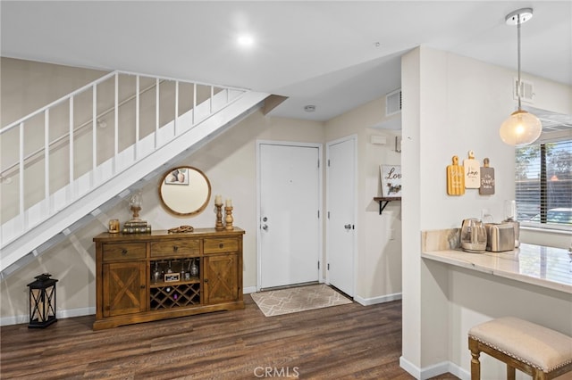 14133 Bayside Dr, Norwalk, CA 90650 - entryway featuring wood finished floors, stairway, and baseboards