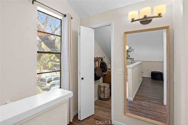 14133 Bayside Dr, Norwalk, CA 90650 - corridor with dark wood-style floors, vaulted ceiling, and baseboards
