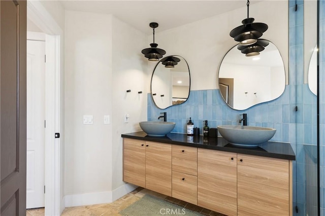 57093 Monticello Ct, Yucca Valley, CA 92284 - bathroom with decorative backsplash, baseboards, a sink, and double vanity