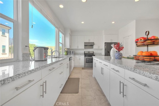 803 N Dalton Ave, Azusa, CA 91702 - kitchen with a sink, stainless steel appliances, white cabinetry, under cabinet range hood, and recessed lighting