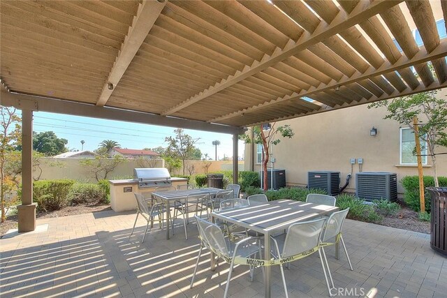 803 N Dalton Ave, Azusa, CA 91702 - view of patio / terrace featuring outdoor dining area, central AC unit, fence, and exterior kitchen