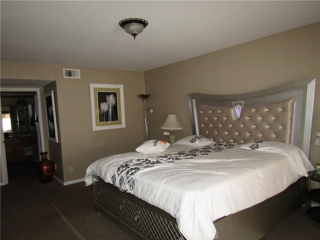 bedroom featuring baseboards, visible vents, and carpet floors