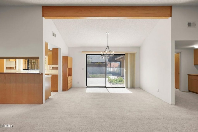 unfurnished living room featuring light carpet, a notable chandelier, beam ceiling, and visible vents
