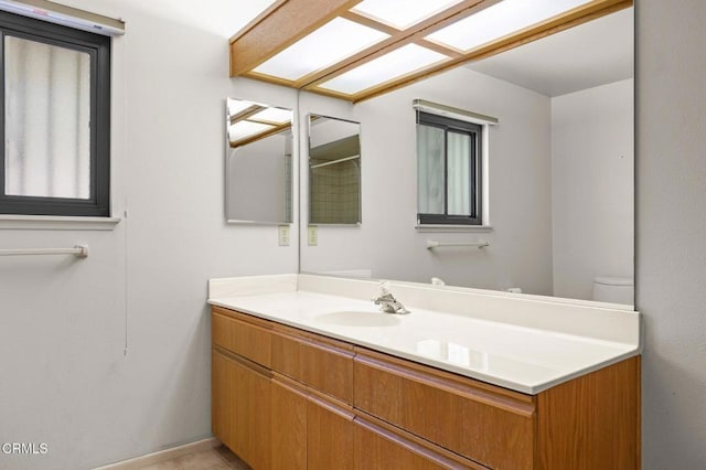 full bathroom with baseboards and vanity