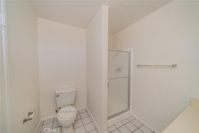 23607 Dracaea Ave, Moreno Valley, CA 92553 - full bath with a stall shower, toilet, tile patterned flooring, and baseboards