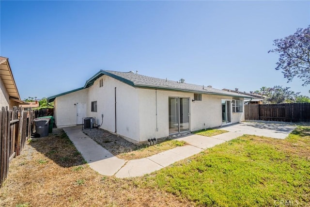 23607 Dracaea Ave, Moreno Valley, CA 92553 - rear view of house featuring stucco siding, a patio area, and central AC unit