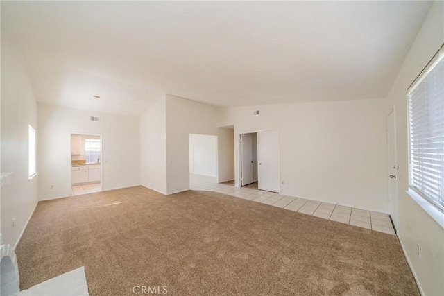 23607 Dracaea Ave, Moreno Valley, CA 92553 - unfurnished room with light colored carpet and light tile patterned flooring