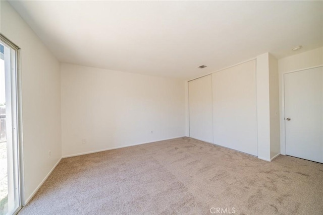 23607 Dracaea Ave, Moreno Valley, CA 92553 - unfurnished bedroom with carpet floors, a closet, and baseboards