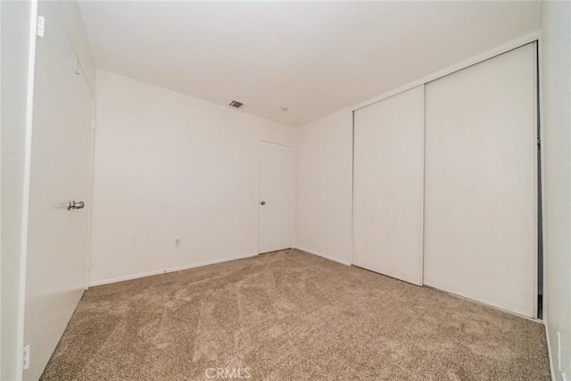 23607 Dracaea Ave, Moreno Valley, CA 92553 - unfurnished bedroom with carpet flooring and a closet