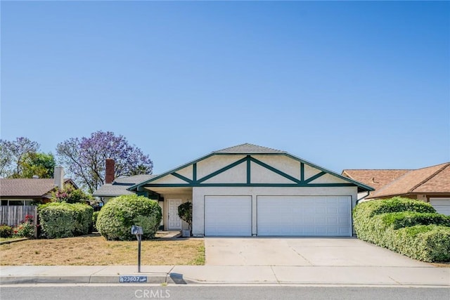 23607 Dracaea Ave, Moreno Valley, CA 92553 - view of front of house with a garage, driveway, and stucco siding