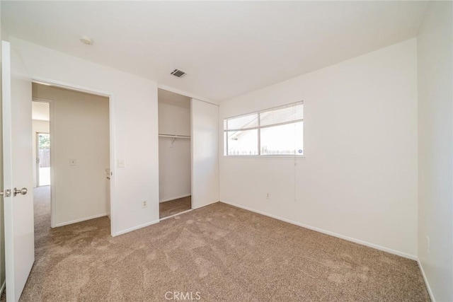 23607 Dracaea Ave, Moreno Valley, CA 92553 - unfurnished bedroom with carpet floors, a closet, and baseboards