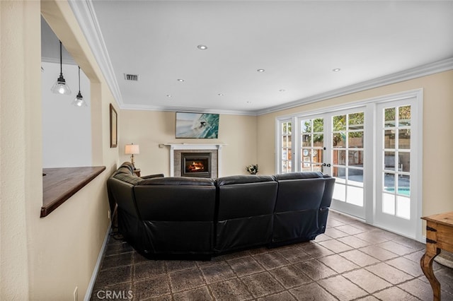 living room with a warm lit fireplace, baseboards, visible vents, french doors, and crown molding