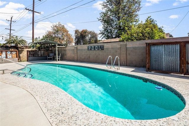 view of pool with a fenced in pool, a patio, and a fenced backyard