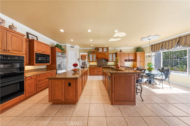 17265 Blue Spruce Ln, Yorba Linda, CA 92886 - kitchen with black appliances, a center island with sink, ornamental molding, a kitchen breakfast bar, and light tile patterned floors