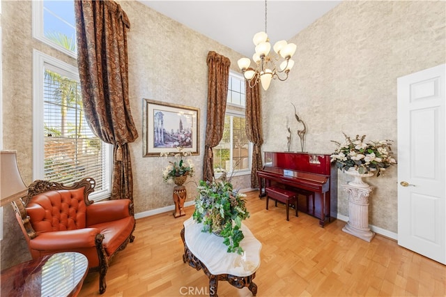 17265 Blue Spruce Ln, Yorba Linda, CA 92886 - sitting room featuring healthy amount of natural light, wallpapered walls, a chandelier, light wood-type flooring, and high vaulted ceiling