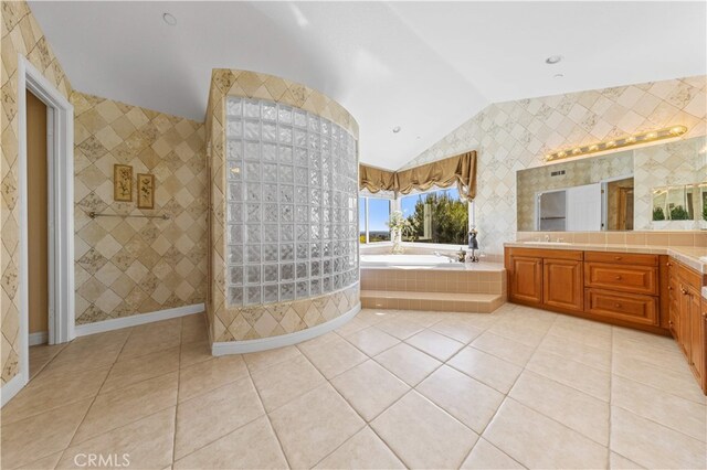 17265 Blue Spruce Ln, Yorba Linda, CA 92886 - full bathroom featuring lofted ceiling, a garden tub, tile patterned flooring, vanity, and a walk in shower