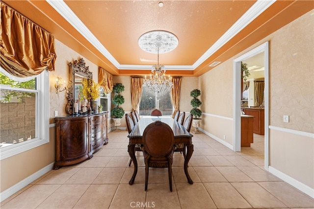 17265 Blue Spruce Ln, Yorba Linda, CA 92886 - dining space featuring a chandelier, a tray ceiling, light tile patterned floors, crown molding, and baseboards
