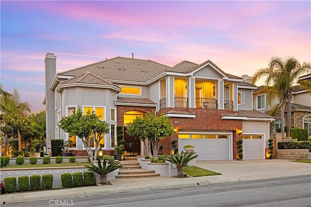 17265 Blue Spruce Ln, Yorba Linda, CA 92886 - view of front facade with driveway, an attached garage, brick siding, and a tiled roof