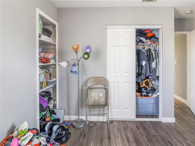 820 W Compton Blvd Unit 5, Compton, CA 90220 - bedroom featuring dark wood-style flooring, a closet, and baseboards