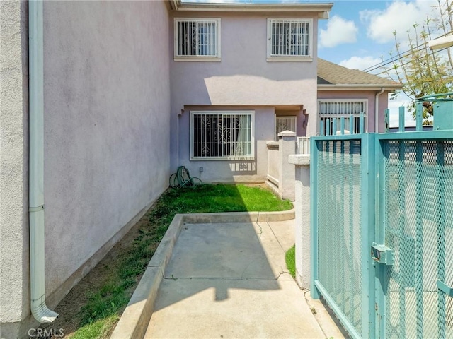 820 W Compton Blvd Unit 5, Compton, CA 90220 - back of house with stucco siding and fence