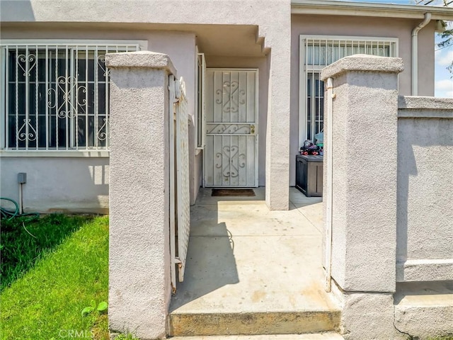 820 W Compton Blvd Unit 5, Compton, CA 90220 - doorway to property with stucco siding