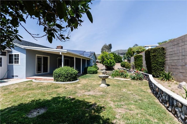 view of yard featuring a patio area and fence