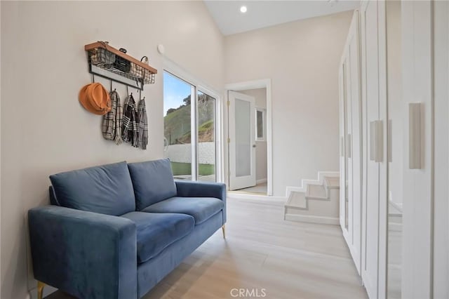 sitting room with baseboards, light wood-style floors, and recessed lighting