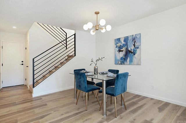 3906 Caminito Del Mar Surf, San Diego, CA 92130 - dining space featuring wood finished floors, a chandelier, and stairway
