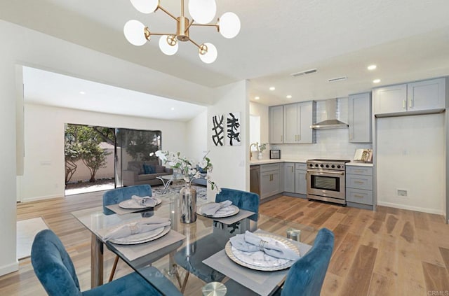 3906 Caminito Del Mar Surf, San Diego, CA 92130 - dining space featuring a chandelier, light wood-style flooring, and recessed lighting