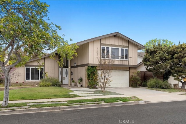 view of front of house with a garage, a front lawn, and concrete driveway