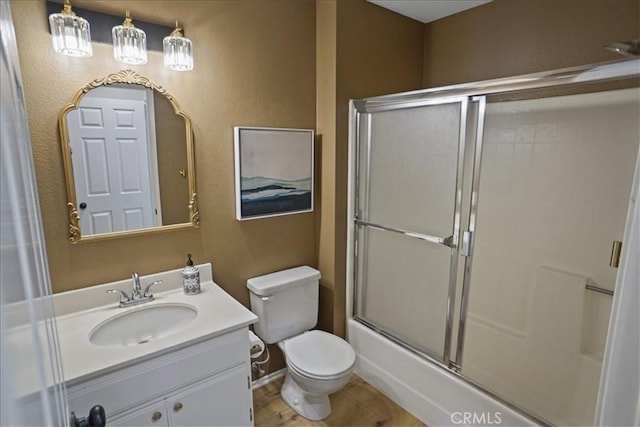 2327 Archwood Ln Unit 125, Simi Valley, CA 93063 - full bath with toilet, wood finished floors, vanity, and a textured wall