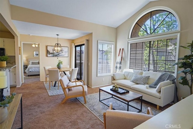 2327 Archwood Ln Unit 125, Simi Valley, CA 93063 - living area featuring baseboards, light colored carpet, and vaulted ceiling