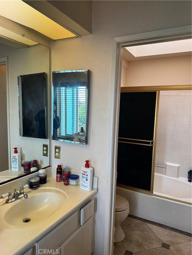 full bathroom featuring toilet, tile patterned floors, shower / bath combination, and vanity