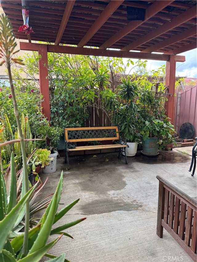 view of patio / terrace featuring fence