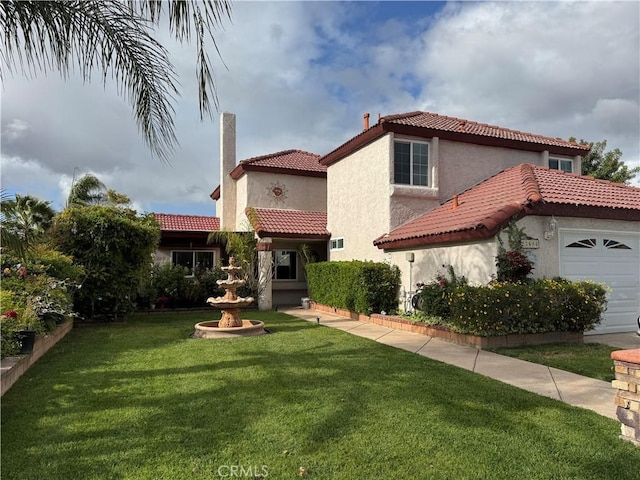 view of front facade featuring stucco siding, a tiled roof, a front yard, and a garage