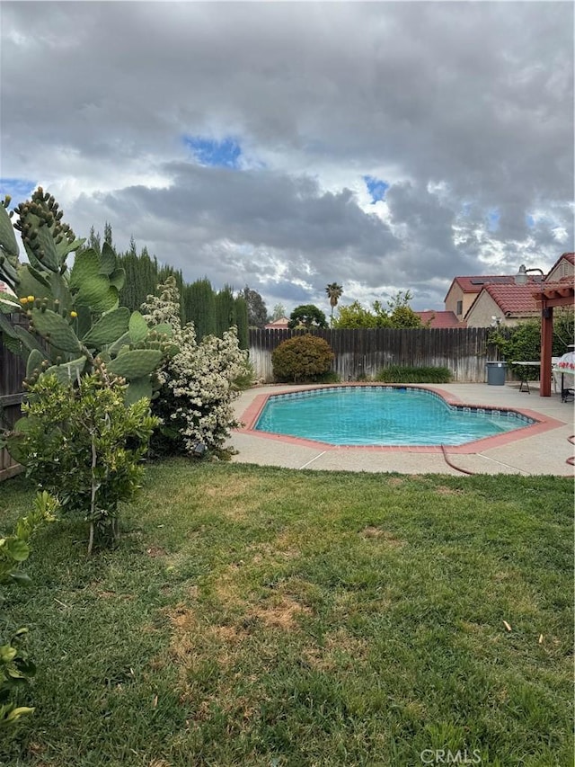 23680 Rhea Dr, Moreno Valley, CA 92557 - view of pool with a fenced backyard, a fenced in pool, and a lawn