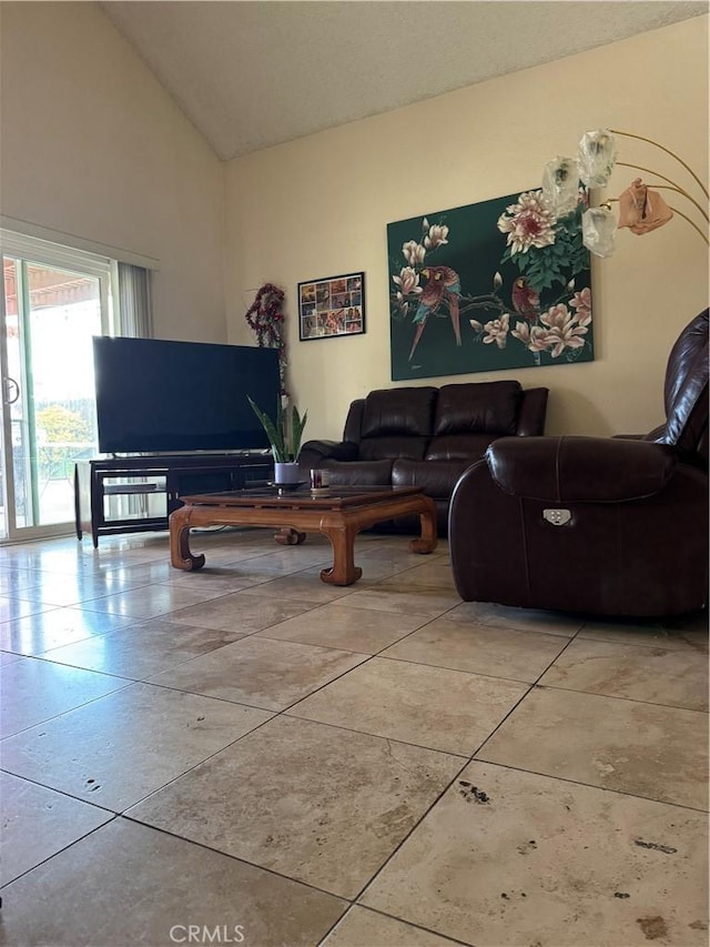 living room with high vaulted ceiling