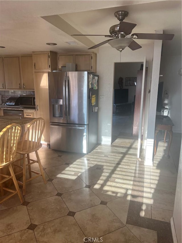 23680 Rhea Dr, Moreno Valley, CA 92557 - kitchen with light tile patterned floors, stainless steel appliances, and ceiling fan