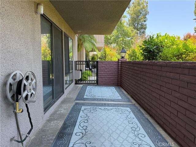 851 Ronda Mendoza Unit B, Laguna Woods, CA 92637 - view of patio featuring a gate