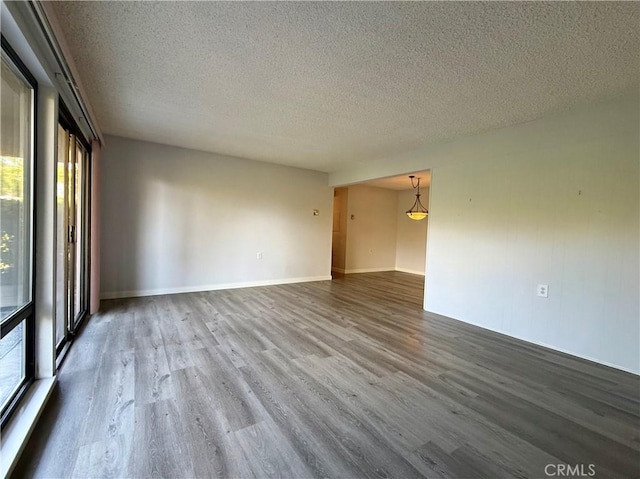 851 Ronda Mendoza Unit B, Laguna Woods, CA 92637 - unfurnished room featuring a textured ceiling and wood finished floors