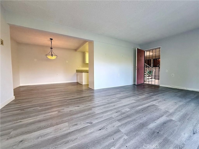 851 Ronda Mendoza Unit B, Laguna Woods, CA 92637 - spare room with wood finished floors and a textured ceiling