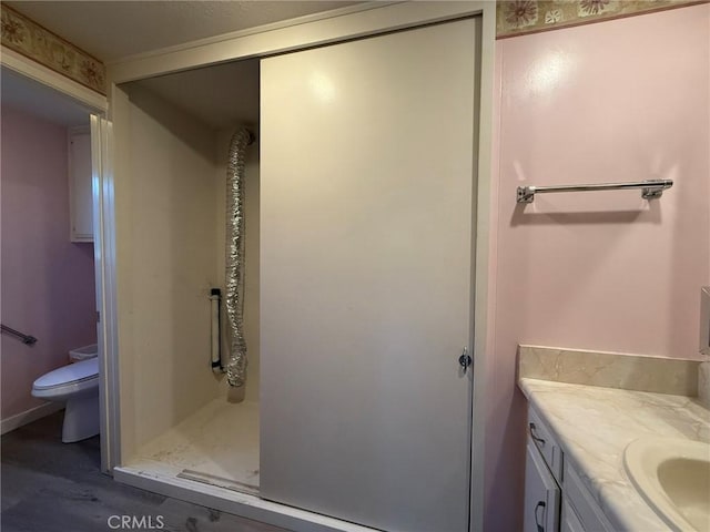 851 Ronda Mendoza Unit B, Laguna Woods, CA 92637 - bathroom with vanity, wood finished floors, and a shower stall