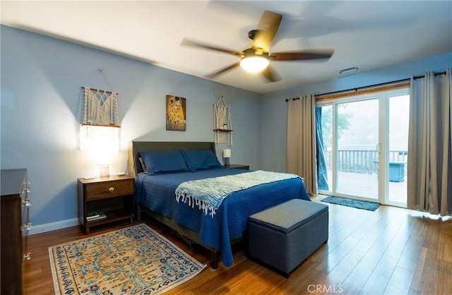 bedroom featuring baseboards, wood finished floors, access to outside, and ceiling fan