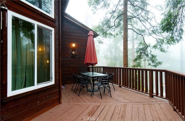 deck with outdoor dining space