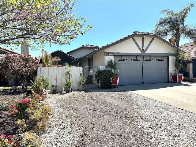 15696 Patricia St, Moreno Valley, CA 92551 - ranch-style house with a tiled roof, driveway, fence, an attached garage, and stucco siding