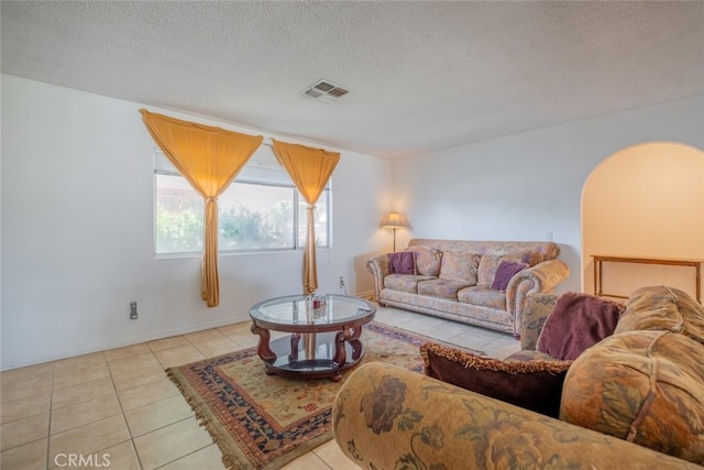 5111 W W Ave M2, Lancaster, CA 93536 - tiled living room with a textured ceiling and baseboards