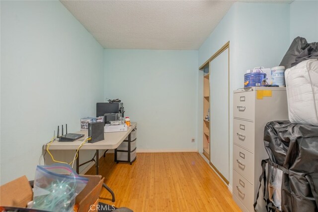 5111 W W Ave M2, Lancaster, CA 93536 - office with light wood finished floors, baseboards, and a textured ceiling