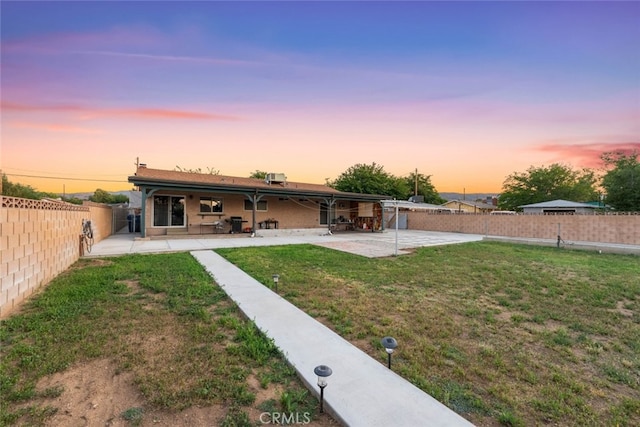 5111 W W Ave M2, Lancaster, CA 93536 - rear view of house with a patio area